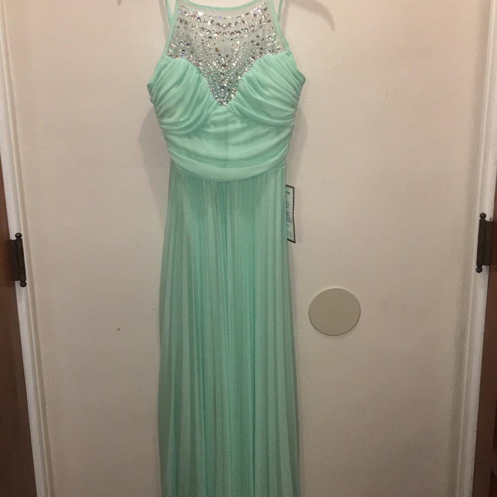 Brand new Light green gown for sale.